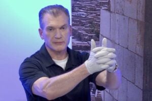 Dr. Shertz demonstrating good clamshell direct pressure technique: fingers interlaced, hands around the extremity to apply white-knuckle hard pressure