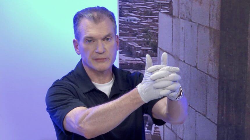 Dr. Shertz demonstrating good clamshell direct pressure technique: fingers interlaced, hands around the extremity to apply white-knuckle hard pressure