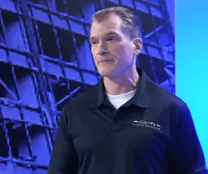 Photograph of Dr. Shertz standing on the professional sound stage where the Crisis Medicine Tactical Casualty Care course was professionally filmed