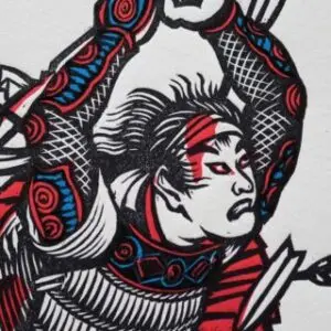 Detail of the printed face of a Samurai in battle, arms raised overhead holding a broken and bloodied sword