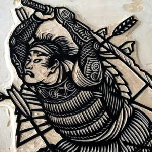 A detail photograph of the woodcut block for the black printing block