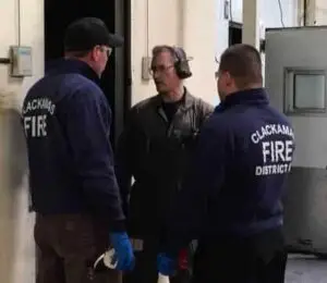 Mike briefs two fire fighters on what they're about to encounter in their scenario