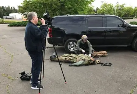As Robert Meyer Burnett films, Mike works on a casualty who has an NPA placed and is secured in a Skedco litter.