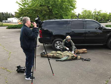 As Robert Meyer Burnett films, Mike works on a casualty who has an NPA placed and is secured in a Skedco litter.