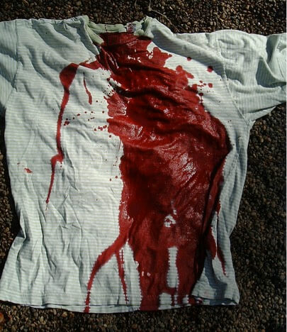 A t-shirt which appears to have the front ⅓ covered in fake blood. In reality, it's only 250 ml of fake blood, or 8 ounces.