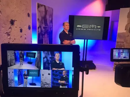 Mike standing on a sound stage for filming with the "quad," showing all 4-camera angles in the foreground