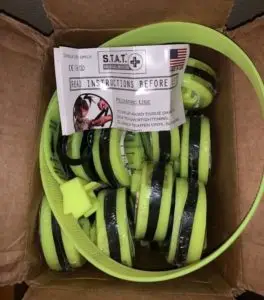 A box of 25 lime green, new STAT tourniquets where 21 of 24 failed in testing