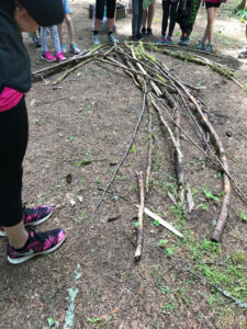 A rescue arrow made in training from sticks to alter potential rescuers