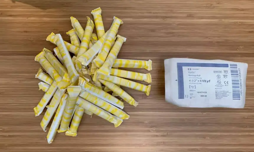 A pile of 36 tampons compared to the one roll of Kerlix Gauze it would take to have an equivalent quantity of absorbent material.