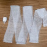 A side by side comparison with one super absorbent tampon, compared to a roll of standard Kerlix gauze, which is a superior choice to stop massive hemorrhage than a tampon
