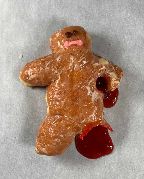 The Happy Little Dough Boy was savagely attacked and severely wounded. A leg was traumatically amputated, he was bleeding jelly filling profusely from axillary wound, and rapidly losing consciousness.
