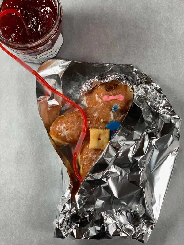 The Wounded Little Doughboy is carefully wrapped in an HPMK to ensure he does not get hypothermic. Cold Jelly Filling does not clot.