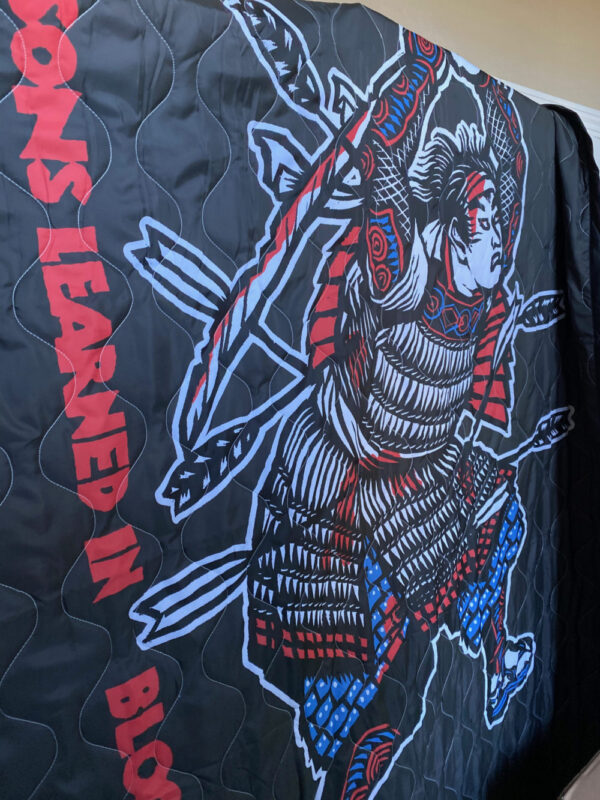 Image of the CM Samurai on our new, limited edition poncho liners