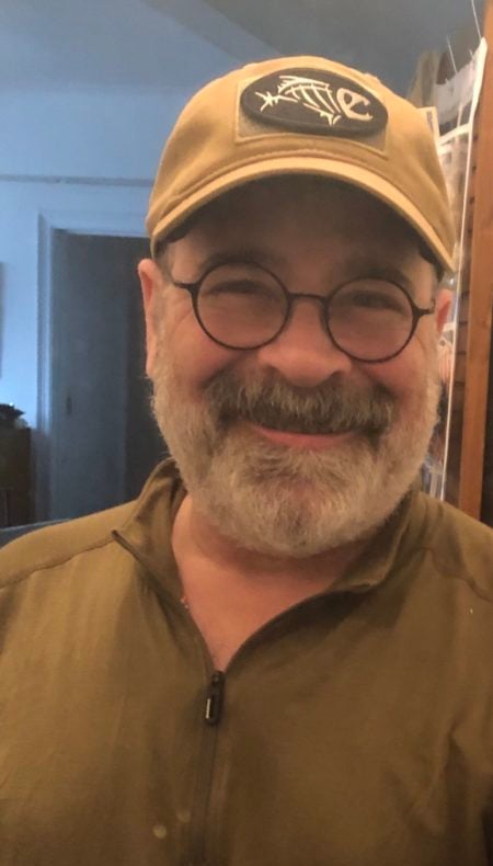 A happy Crisis Medicine student smiling because he learned to train first and buy his gear second