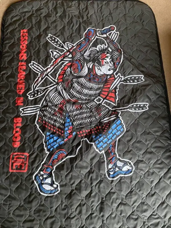 Crisis Medicine custom poncho liner / woobie made in the USA by Woobie USA, emblazoned with the Crisis Medicine's Samurai logo