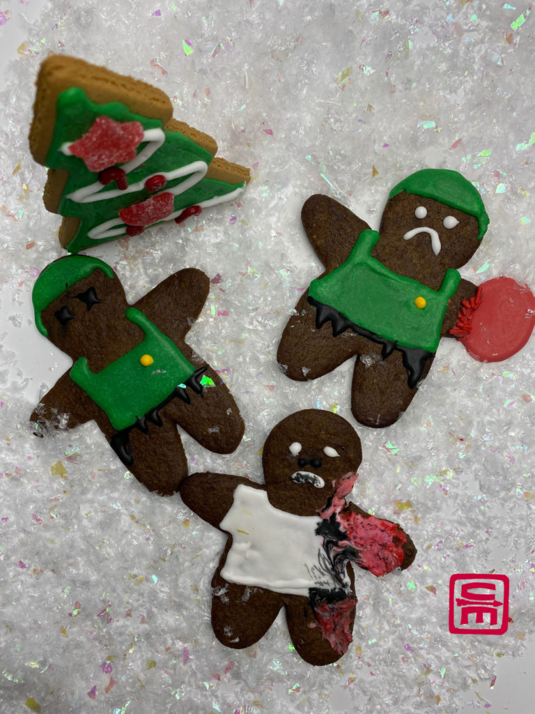 The third group of wounded gingerbread: an amputated arm, a burned neighbor, and a deceased SWAT officer