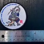 A close up of the 3" woven patch with merrowed edge showing the Crisis Medicine K9 TECC for Human Providers patch