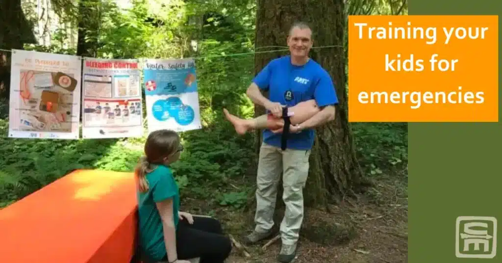 Dr. Shertz in his alter ego as Camp counselor "Omega" stands ruggedly in the woods training Girl Scouts to be prepared for emergencies