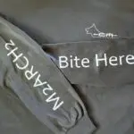 Crisis Medicine K9 TECC for Human Providers Tshirts sleeve detail - Bite Here for your partner M2ARCH2 to remind yourself the critical steps in K9 care